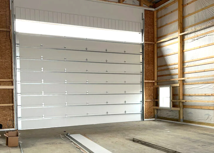 Professional garage door installation in progress at a residential property in Grove City, Ohio, highlighting high-quality materials and expert craftsmanship