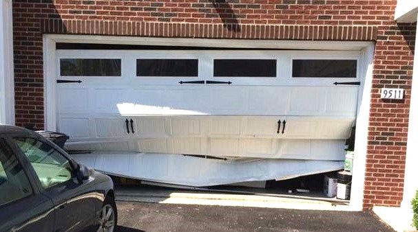 Professional garage door installation in progress at a residential property in Grove City, Ohio, highlighting high-quality materials and expert craftsmanship