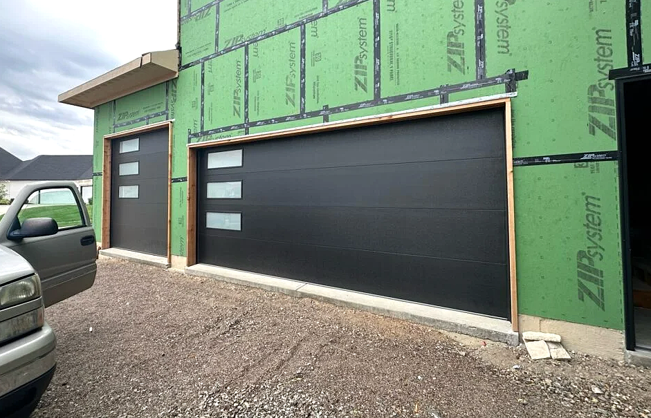 Local garage door repair team servicing a residential garage door in Grove City, Ohio, showcasing expert repairs and community-focused service.