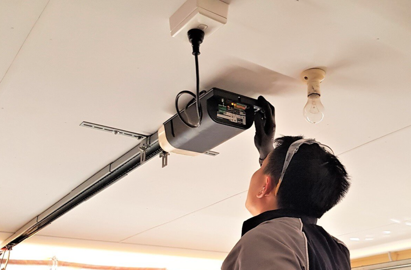 Expert technician of Garage Door Repair Grove City Ohio doing garage door opener repair.