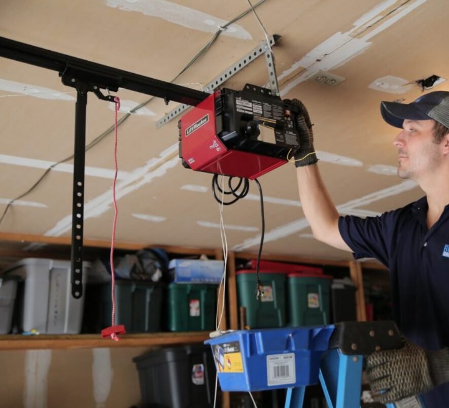 Technician performing garage door opener repair in Grove City, Ohio