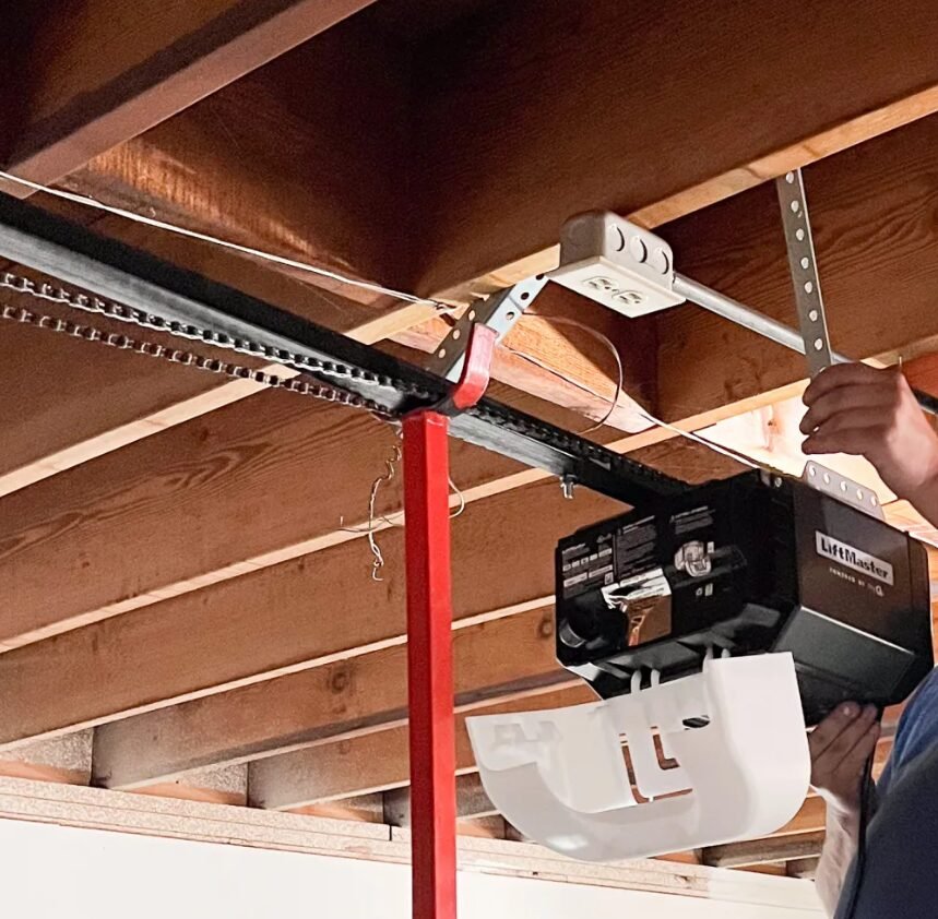 Technician performing garage door opener repair in Grove City, Ohio