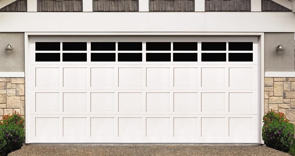Expert technicians performing garage door repair at a residence in Grove City, Ohio